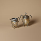 Ensemble de crémier et sucrier décoratifs antiques sur pieds