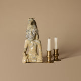 Carved Stone Figure with Brass Candleholder Duo